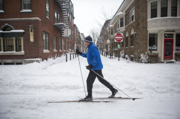 PHILADELPHIA, PENNSYLVANIA - JANUARY 23: A man skies through downtown Philadelphia as snow continues to fall on January 23, 2016 in Philadelphia, Pennsylvania. The city, which announced a snow emergency, is expected to get over 18 inches of snowfall, along with much of the Mid Atlantic States. (Photo by Jessica Kourkounis/Getty Images)
